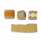 Decorative burlap jute lace ribbon rolls with daisy, heart, and gold border designs for DIY crafts, gift wrapping, bouquet decoration, gajra making, and floral arrangements on a white background.