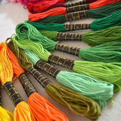 10-piece punch needle embroidery kit featuring 9 colorful embroidery floss skeins, adjustable punch needle tool, threaders, and accessories.